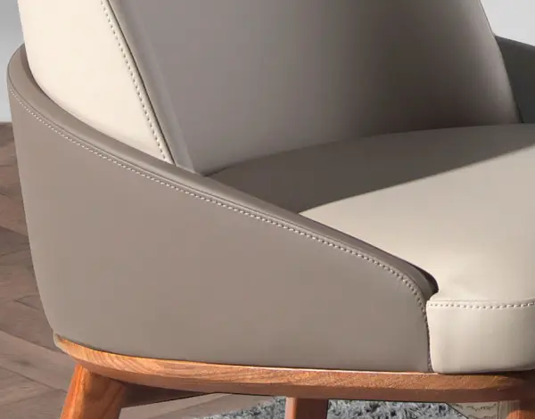 Silla tapizada en polipiel gris y patas en madera de fresno