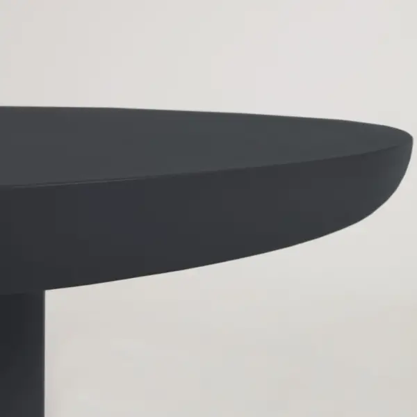 Mesa redonda de exterior de cemento con acabado negro Taimi