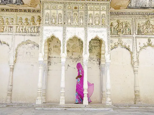 Woman walking through temple india alison wirght